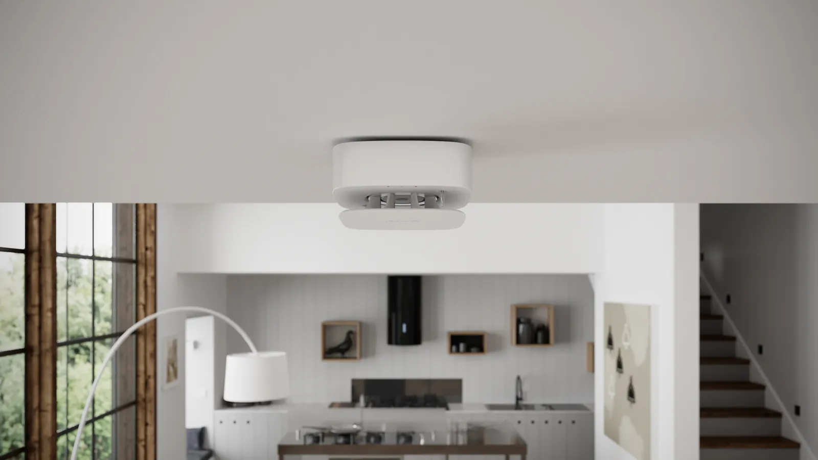 Ajax FireProtect 2-rookmelder aan het plafond van een lichte open keuken