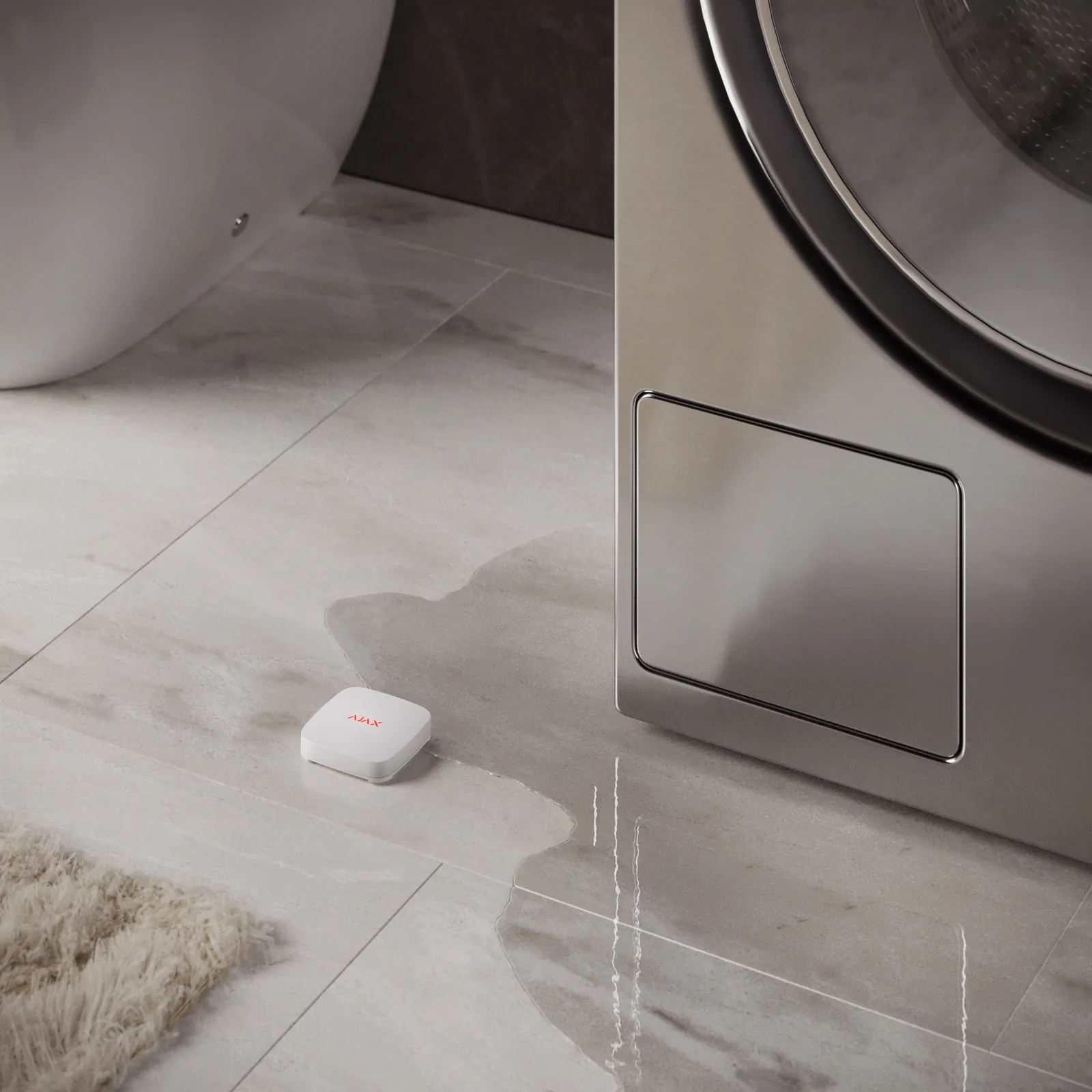 Ajax LeaksProtect-lekdetector op de vloer naast een wasmachine en een plas water